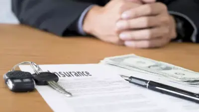 Insurance paperwork representing lower liability premiums